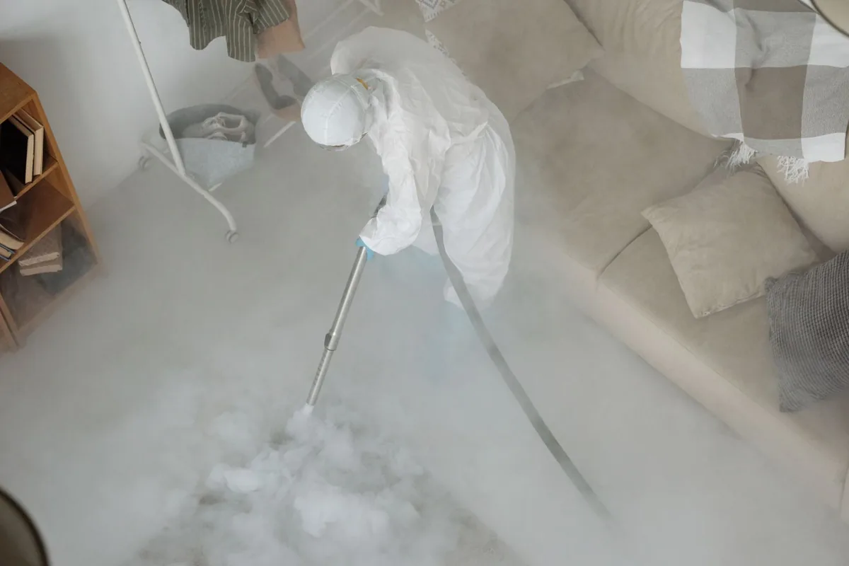 Biohazard cleanup technician in protective equipment, Country Acres, Wichita, KS